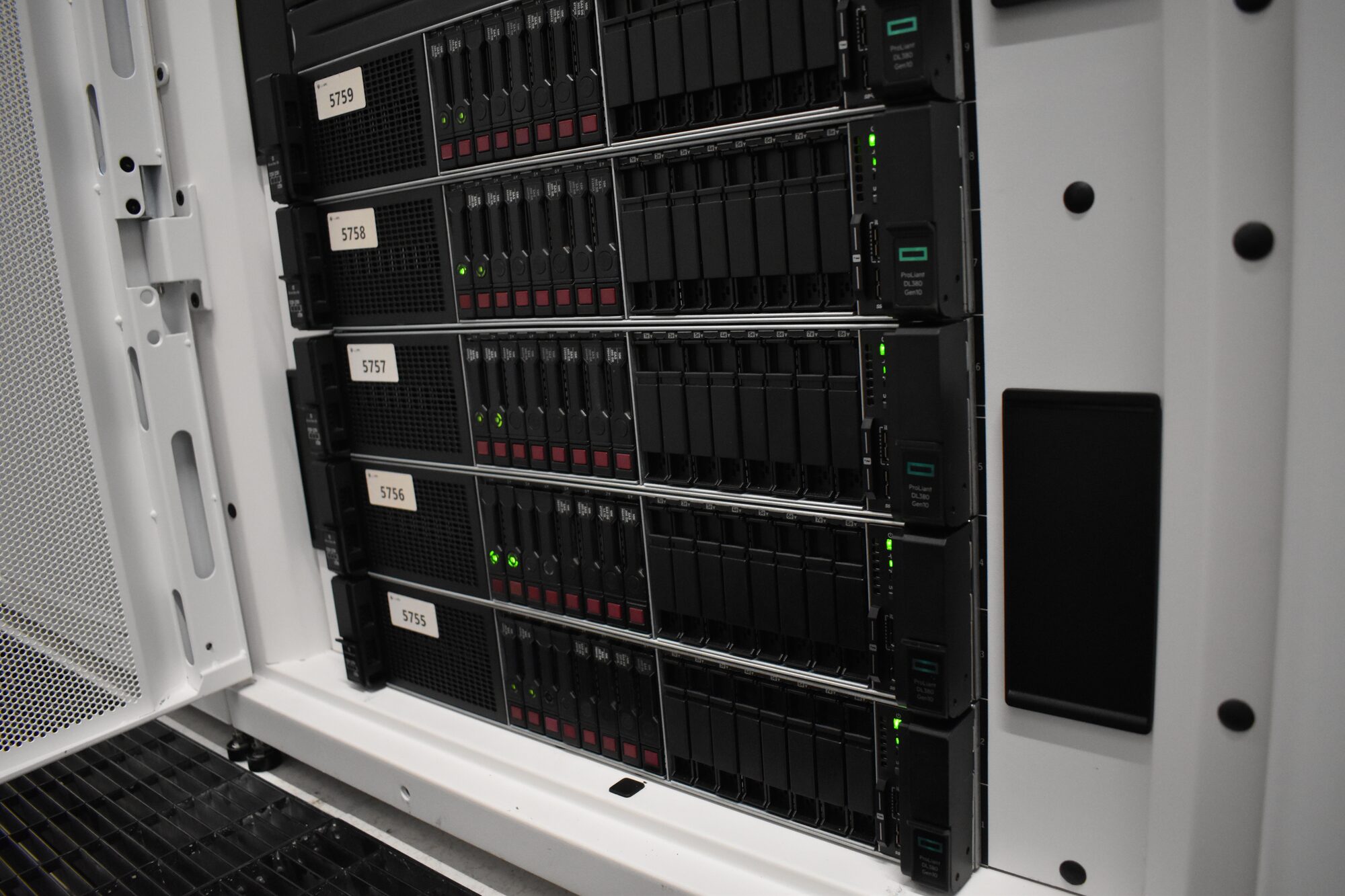 A cabinet of HPE ProLiant DL380 Gen10 servers, door open