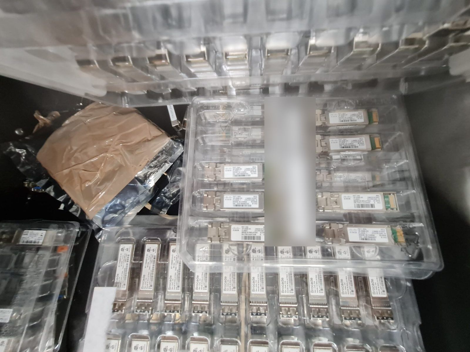 Trays of original transceivers on the shelf