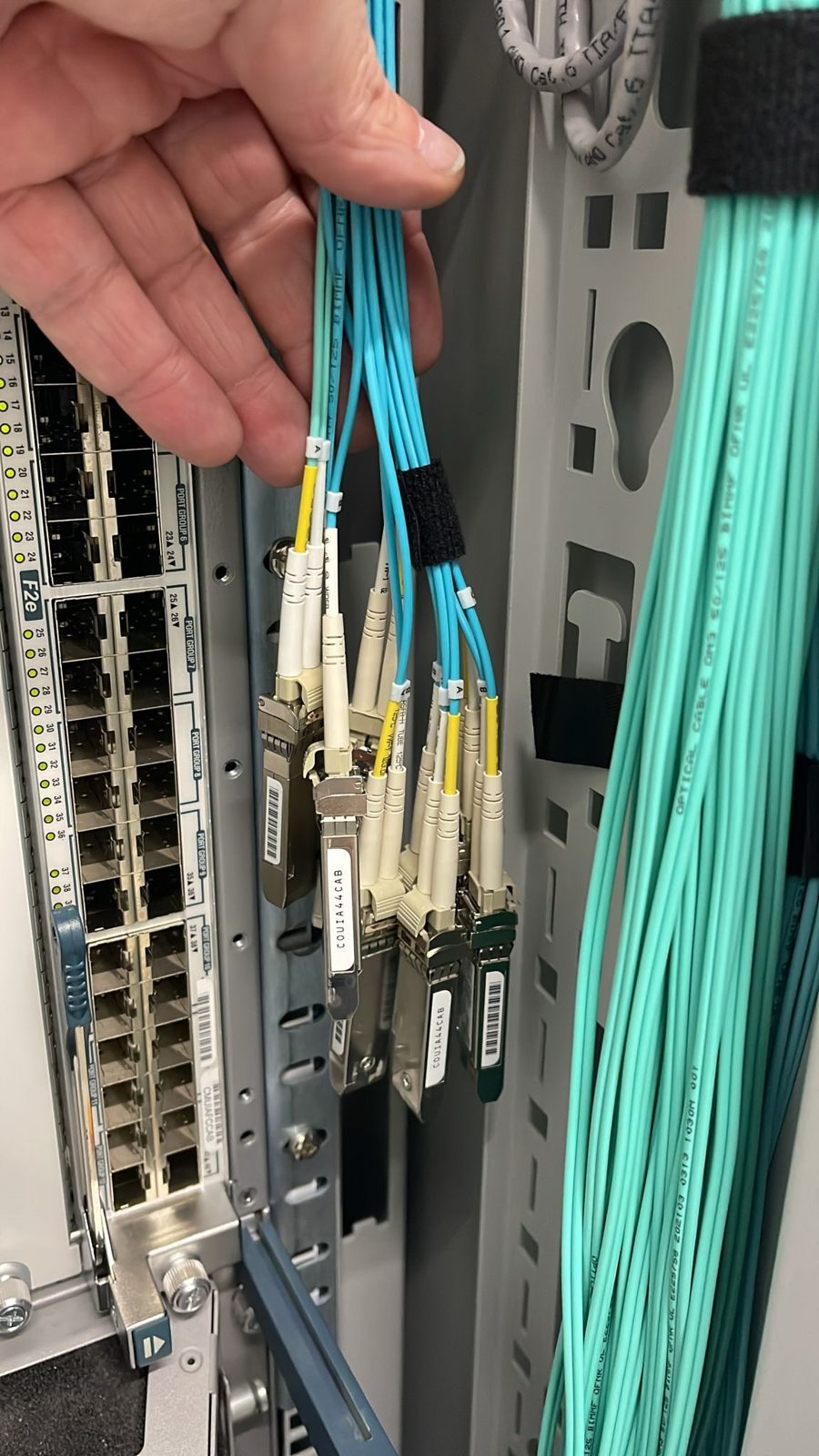 LC fibre in hand at the rack, 2025